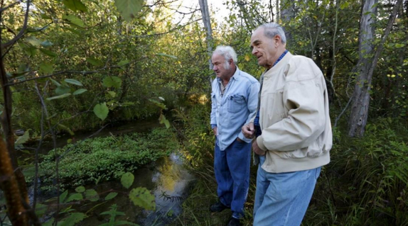 John McLane and Jim Maturen survey damage to Twin Creek by Nestle.