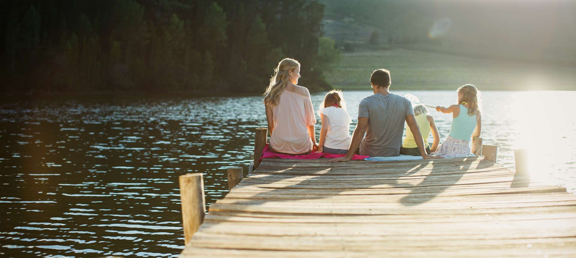 Family Enjoying Crystal Clear Lake Water